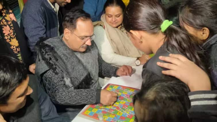 Delhi Elections 2025 Delhi BJP Virendra Sachdeva Spends Night With Slum Dwellers Plays Snakes And Ladder Delhi Election 2025: Delhi BJP Chief Spends Night In Slum, Plays Snakes And Ladder With Kids