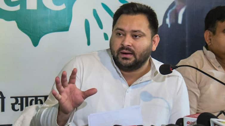 Tejashwi Yadav Ducks As Drone Crashes Into His Podium During Rally At Patna Watch Video Bihar Election 2025 Tejashwi Yadav Ducks As Drone Crashes Into His Podium During Rally At Patna: VIDEO