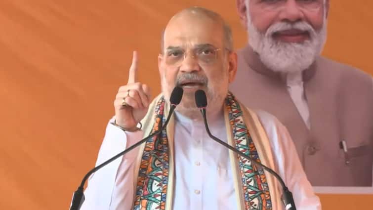 Amit Shah Hits Out At Rahul Gandhi Over Foreign Trips Voter Adhikar Yatra RJD Congress BJP Bihar Election 2025 ‘Infiltrators Will Be In Every District Of Bihar’: Shah Warns Against Congress-RJD Alliance, Slams Rahul